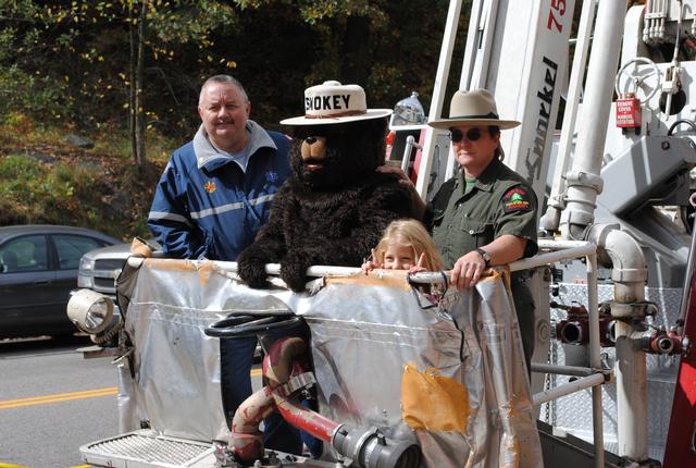 Tim Donaldson provides a lift for Smokey Bear, Forest Ranger Julie Harjung, and friend on SLVFD's 75' Snorkel 10/2/2010