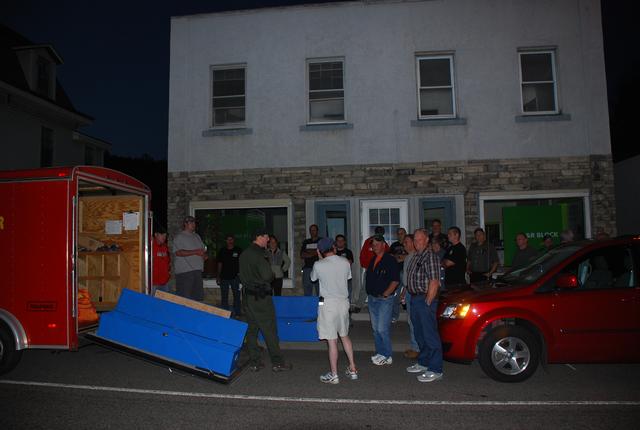 Forest Ranger Pete Evans displays wildland firefighting equipment to SLVFD members during fire school at the SLVFD fire house 7/29/2010